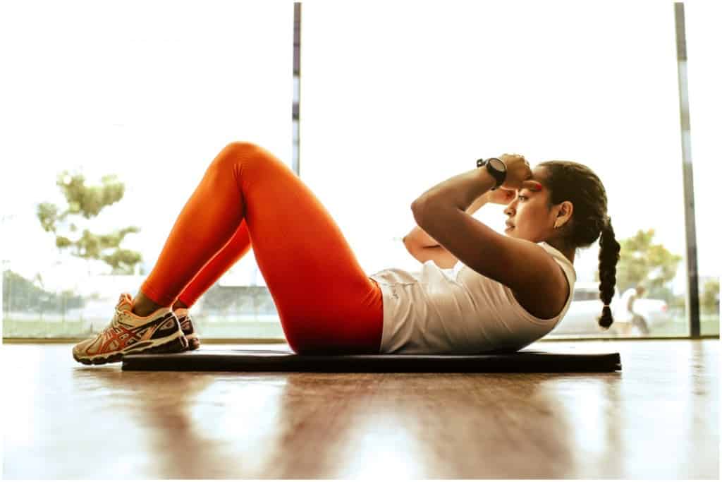 woman doing crunches in self-care sanctuary