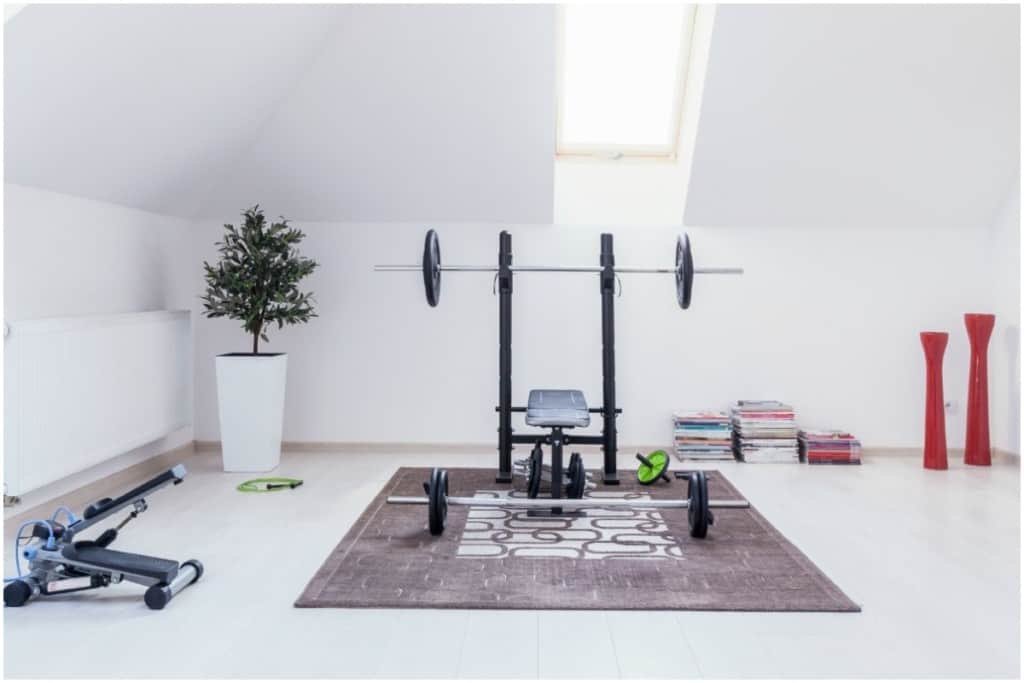 bench press in home gym attic 